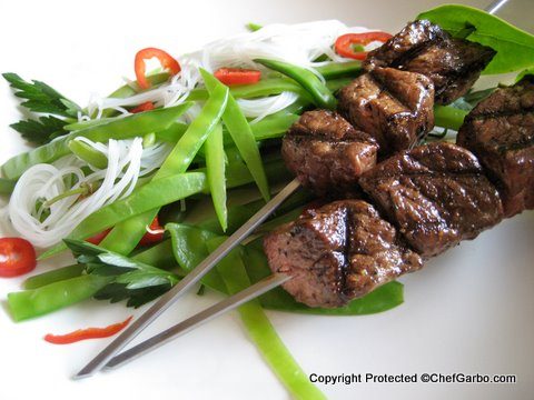 Gluten Free - Organic - Grass Fed Beef Kabobs with Rice Noodles on Bed of Blanched Snow Pea Salad